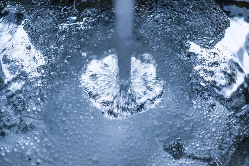 Water falling on a mirror